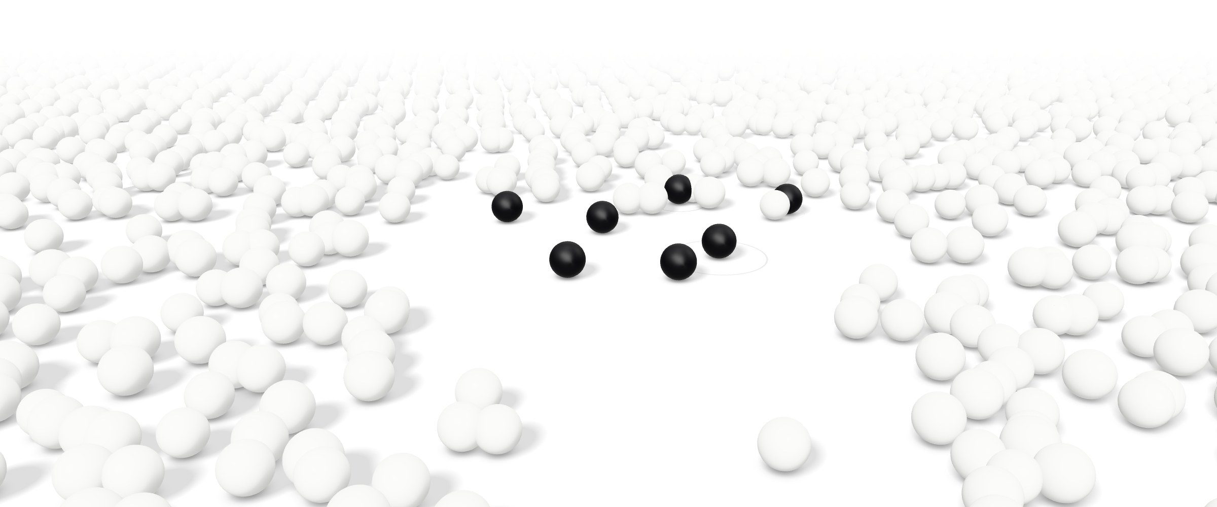 White clay spheres spread across a white floor, with a few black spheres standing out among them.
